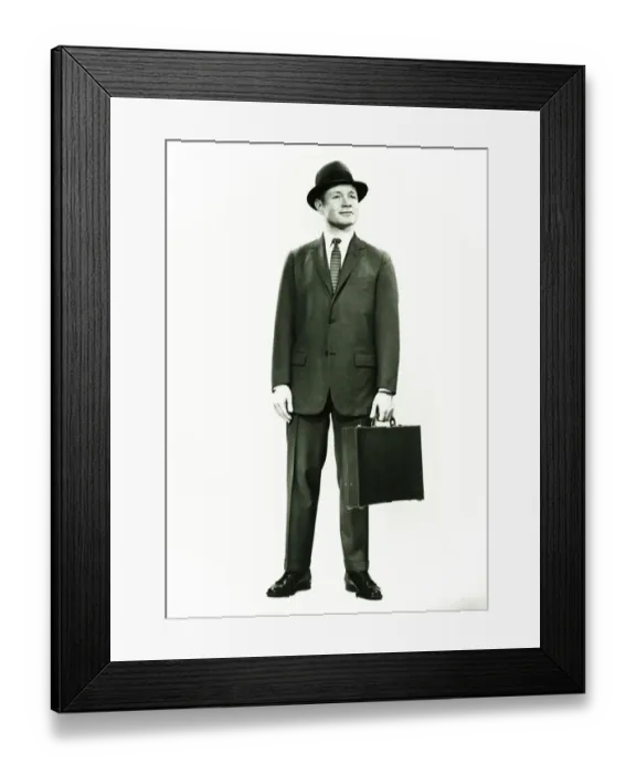 Framed Print : Businessman standing in studio, (B&W), portrait Framed Print : Businessman standing in studio, (B&W), portrait