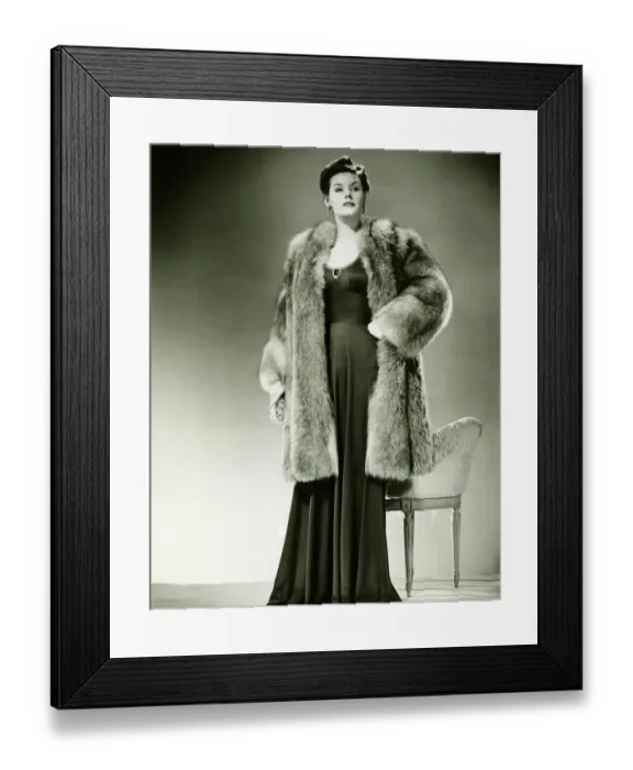 Framed Print : Woman in fur coat posing in studio, (B&W), portrait Framed Print : Woman in fur coat posing in studio, (B&W), portrait