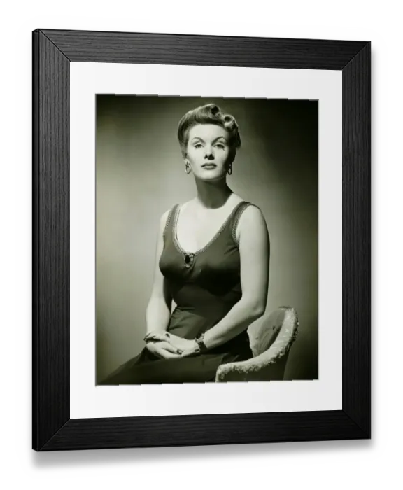Framed Print : Woman in evening dress posing in studio, (B&W), portrait Framed Print : Woman in evening dress posing in studio, (B&W), portrait