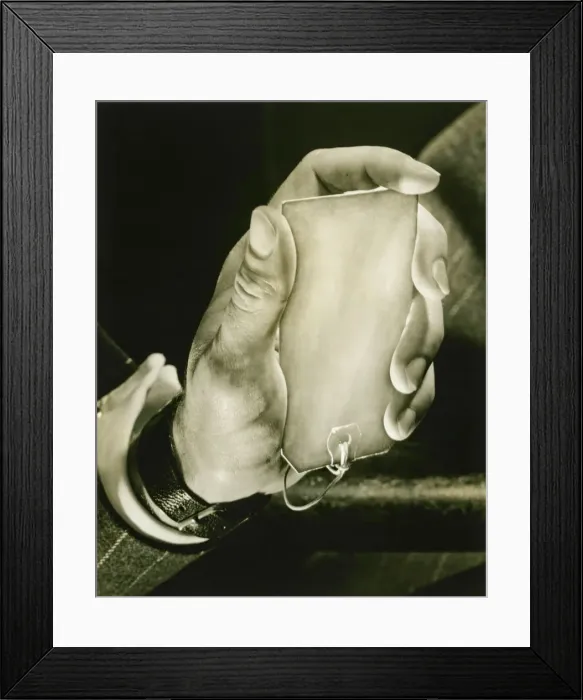 Framed Print : Man holding key label, close-up of hand, (B&W) Framed Print : Man holding key label, close-up of hand, (B&W)
