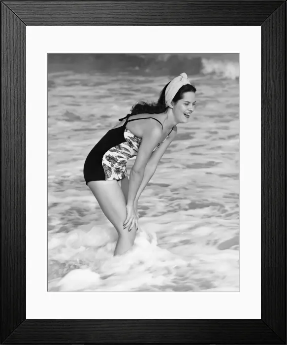 Framed Print : Smiling woman standing in sea, (B&W) Framed Print : Smiling woman standing in sea, (B&W)