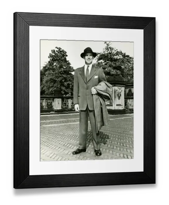 Framed Print : Elegant man carrying overcoat courtyard, (B&W) Framed Print : Elegant man carrying overcoat courtyard, (B&W)