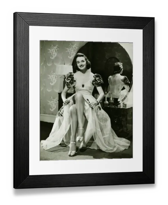 Framed Print : Glamorous woman in evening gown showing legs, portrait, (B&W) Framed Print : Glamorous woman in evening gown showing legs, portrait, (B&W)