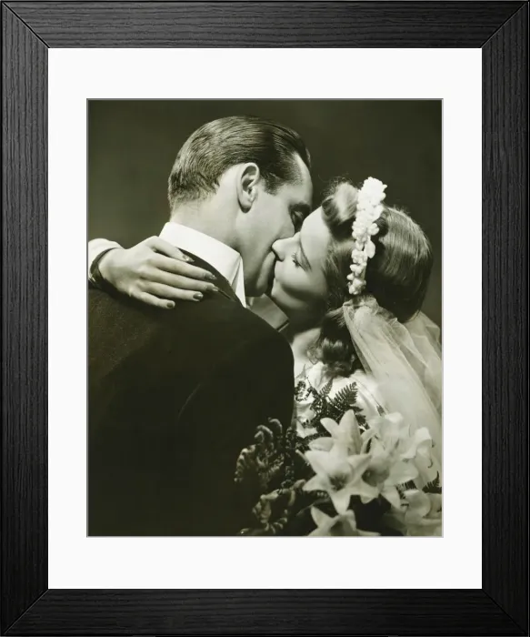 Framed Print : Bride and Groom kissing in studio, (B&W)