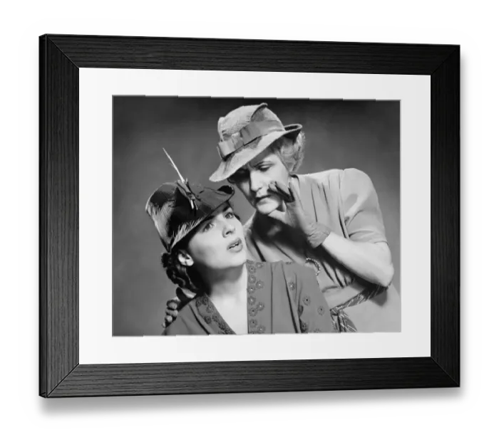 Framed Print : Two women whispering in studio, (B&W), portrait Framed Print : Two women whispering in studio, (B&W), portrait