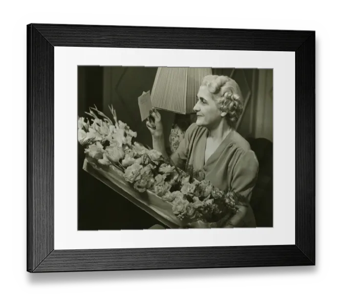 Framed Print : Mature woman receiving box of flowers, (B&W)