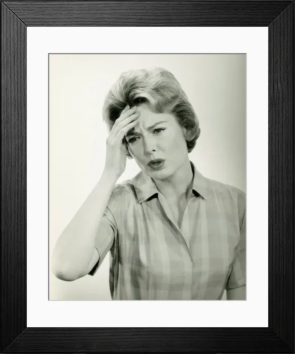 Framed Print : Woman with headache, posing in studio, (B&W) (Portrait) Framed Print : Woman with headache, posing in studio, (B&W) (Portrait)