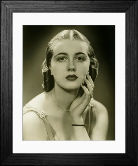 Framed Print : Elegant woman in sleeveless gown posing in studio, (B&W), portrait Framed Print : Elegant woman in sleeveless gown posing in studio, (B&W), portrait