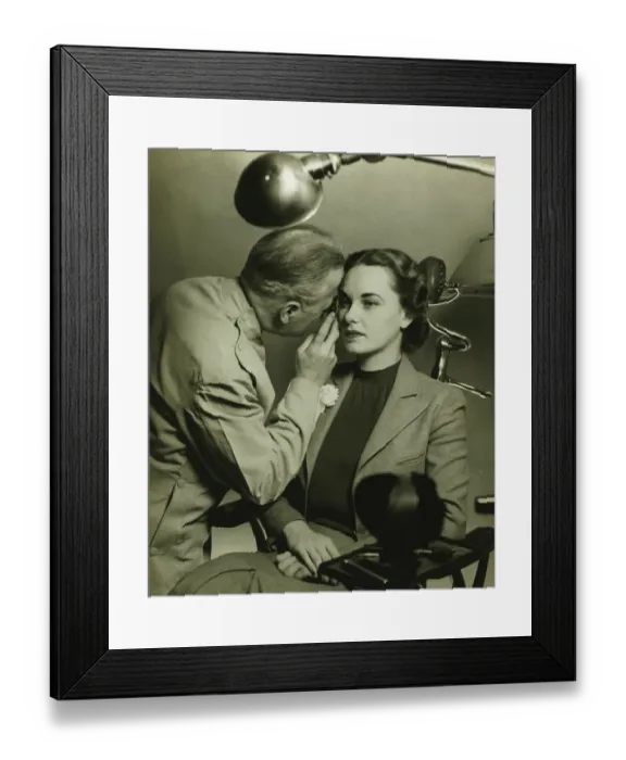 Framed Print : Optician examining womans eye, (B&W)