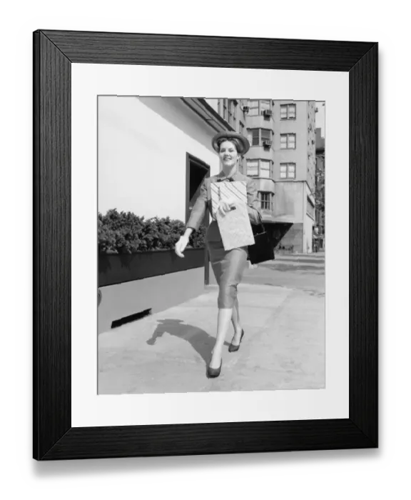 Framed Print : Elegant woman walking on street after shopping, (B&W) Framed Print : Elegant woman walking on street after shopping, (B&W)