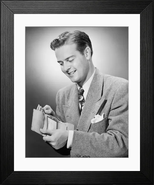 Framed Print : Elegant man putting US dollars bills into wallet, (B&W) Framed Print : Elegant man putting US dollars bills into wallet, (B&W)