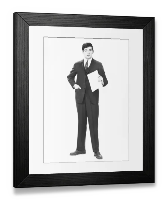 Framed Print : Elegant man holding blank sheet of paper in studio, (B&W), portrait Framed Print : Elegant man holding blank sheet of paper in studio, (B&W), portrait