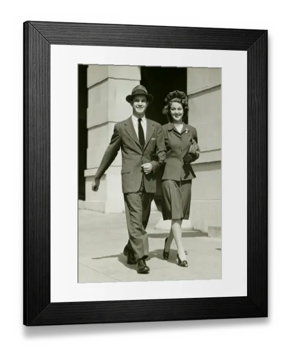 Framed Print : Young couple walking arm in arm on sidewalk, (B&W) Framed Print : Young couple walking arm in arm on sidewalk, (B&W)