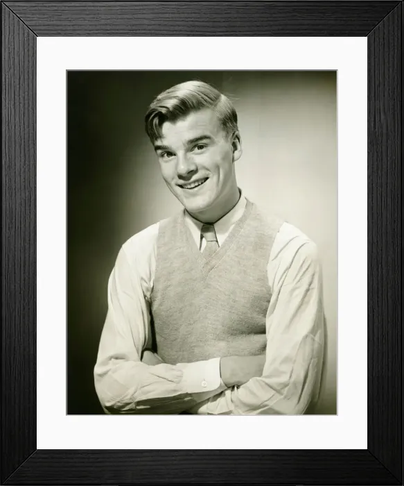 Framed Print : Young man wearing jumper, smiling, (B&W), portrait Framed Print : Young man wearing jumper, smiling, (B&W), portrait