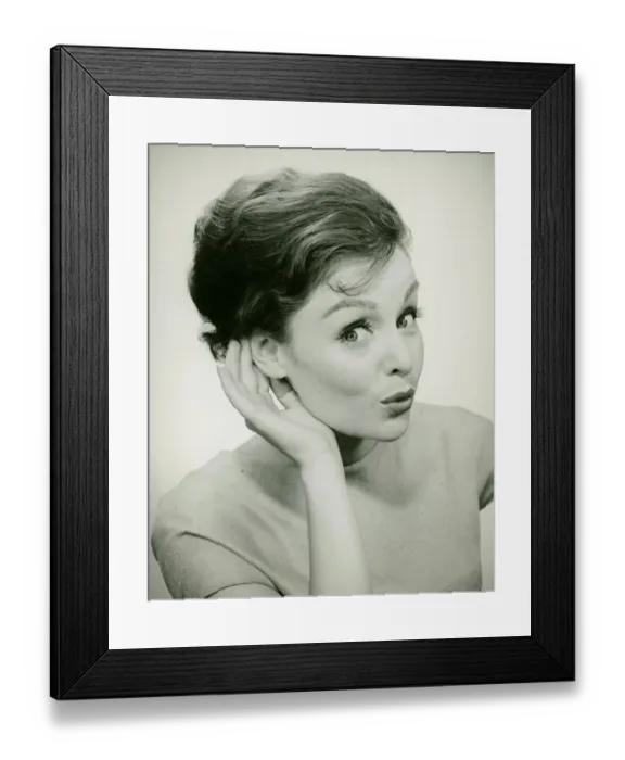 Framed Print : Young woman cupping hand to ear, (B&W), (Portrait) Framed Print : Young woman cupping hand to ear, (B&W), (Portrait)