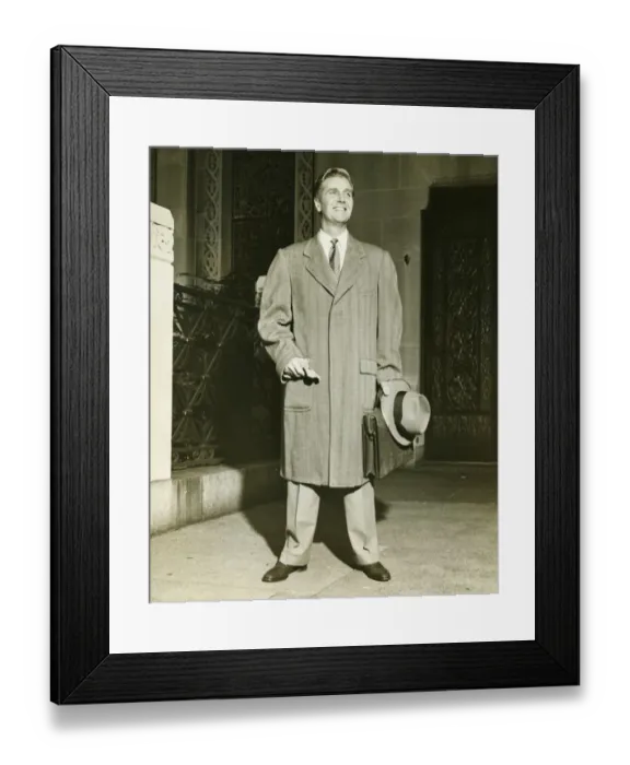 Framed Print : Smiling man in top coat standing outdoors, (B&W) Framed Print : Smiling man in top coat standing outdoors, (B&W)