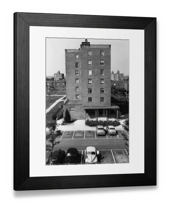 Framed Print : Cars in parking lot outside flats