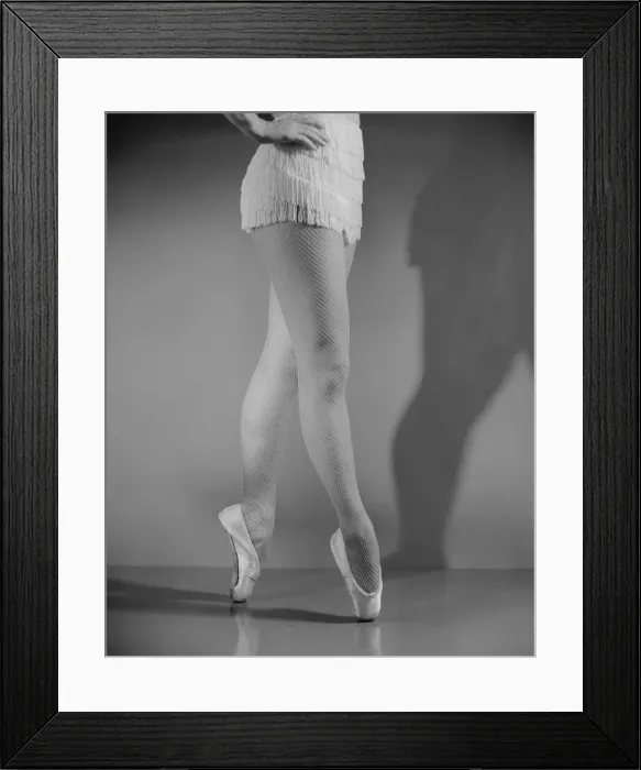 Framed Print : Ballet dancer standing on tiptoes, low section Framed Print : Ballet dancer standing on tiptoes, low section