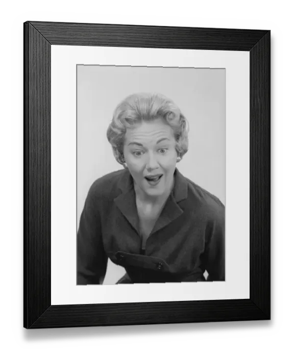 Framed Print : Studio shot of mid adult woman with facial expression