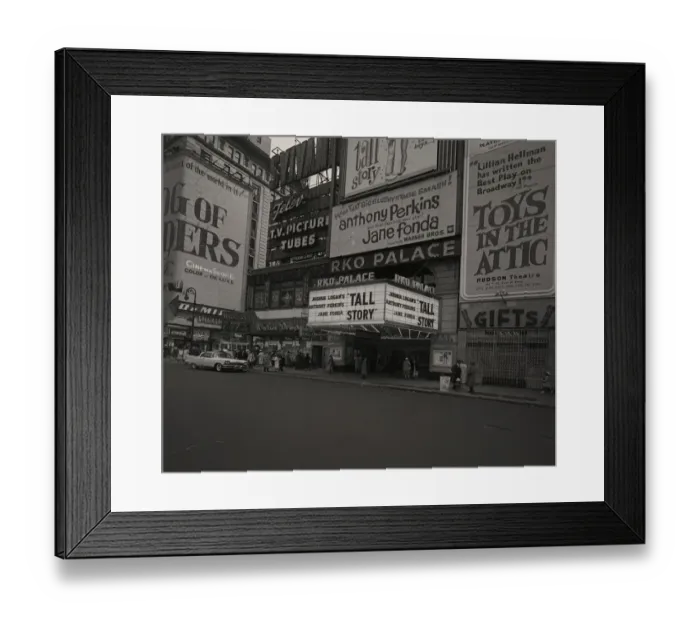 Framed Print : Billboards outside movie theater