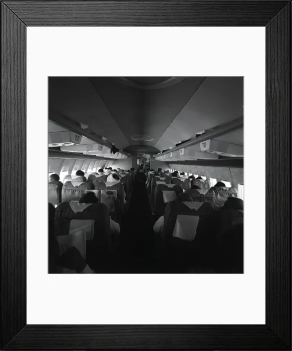 Framed Print : Passengers on airplane, rear view Framed Print : Passengers on airplane, rear view