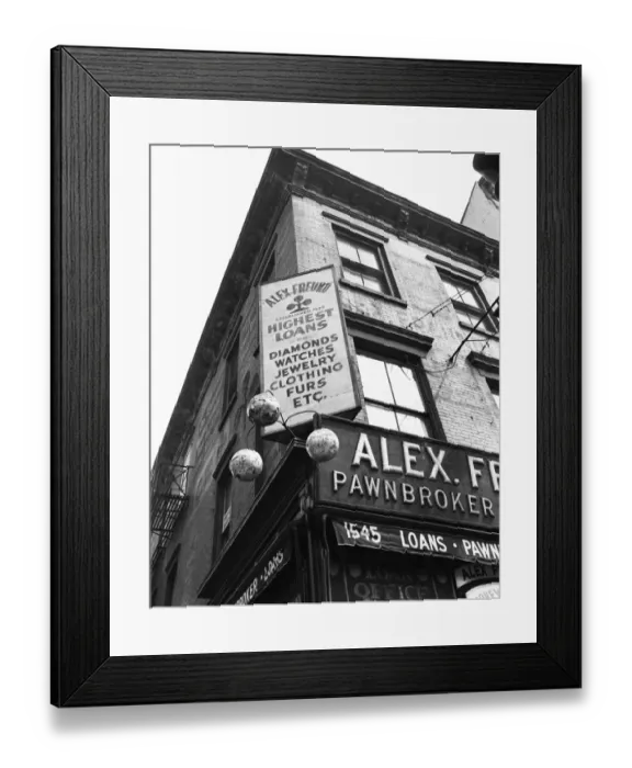 Framed Print : Comerical sign at building corner, low angle view Framed Print : Comerical sign at building corner, low angle view