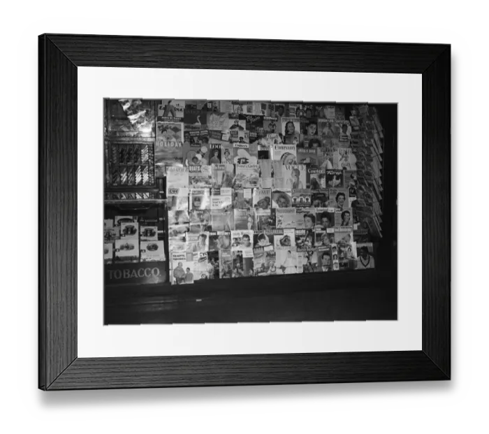 Framed Print : Variety of magazines in window display