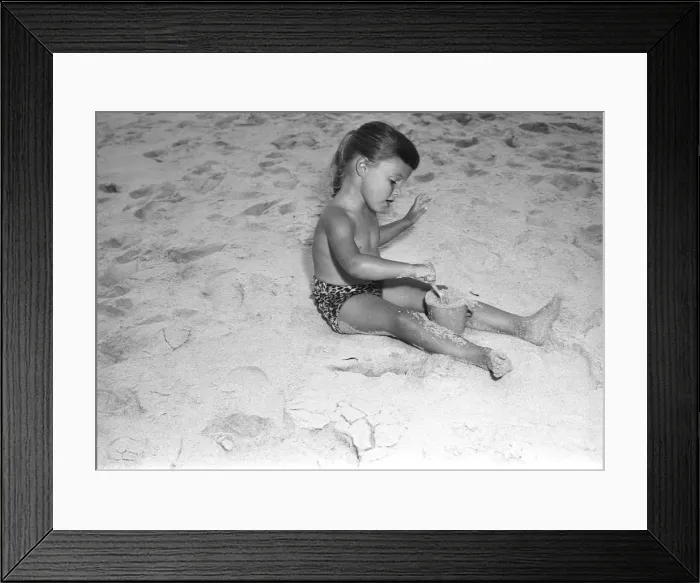 Framed Print : Girl (4-5) playing in sand Framed Print : Girl (4-5) playing in sand