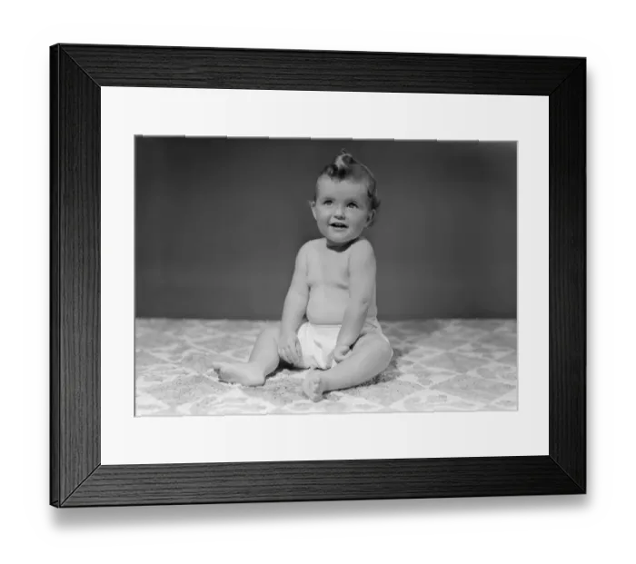 Framed Print : Baby girl (12-17 months) sitting on blanket Framed Print : Baby girl (12-17 months) sitting on blanket