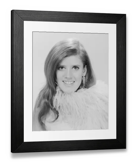 Framed Print : Studio portrait of young woman smiling Framed Print : Studio portrait of young woman smiling