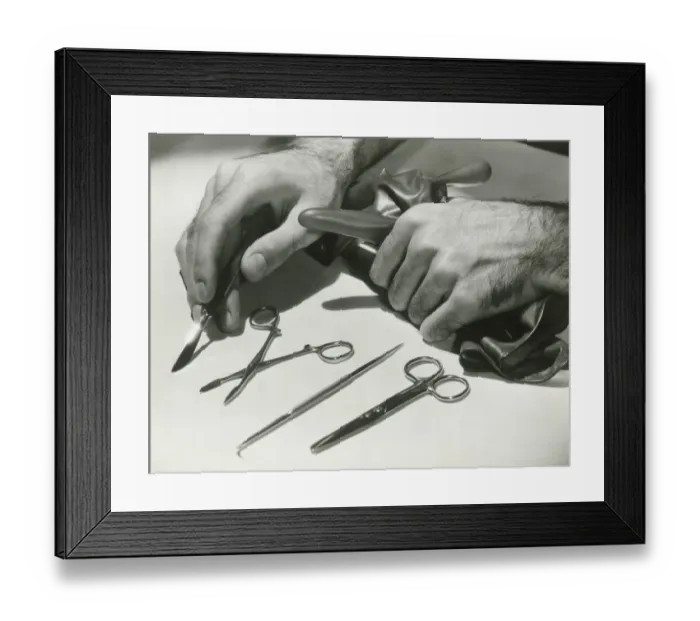 Framed Print : Man arranging surgical tools, close up of hands Framed Print : Man arranging surgical tools, close up of hands
