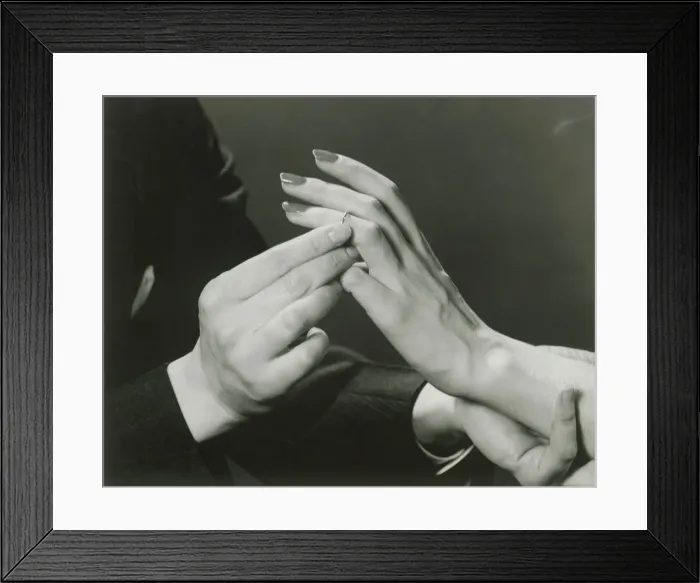 Framed Print : Man putting wedding ring on womans finger Framed Print : Man putting wedding ring on womans finger