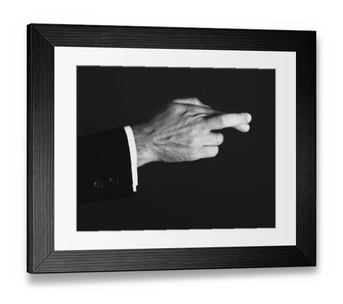 Framed Print : Man crossing fingers in studio, (B&W), close-up Framed Print : Man crossing fingers in studio, (B&W), close-up