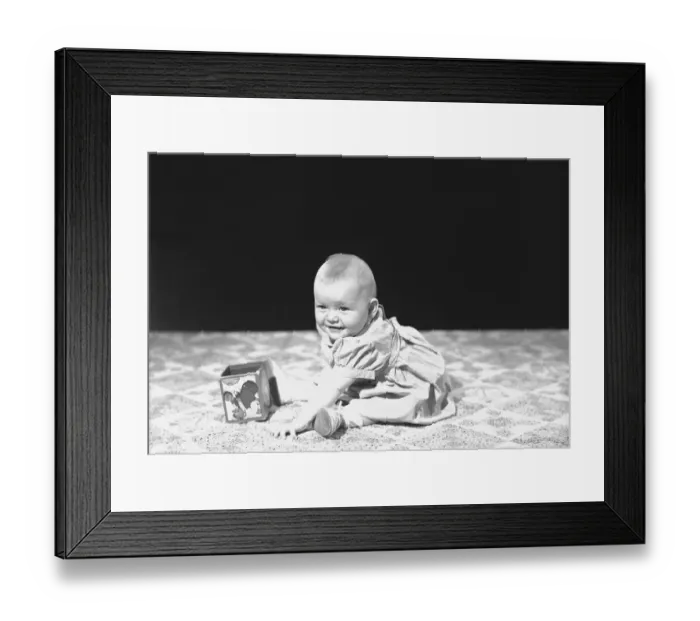 Framed Print : Baby girl (12-15 months) playing on blanket, (B&W)