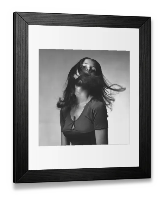 Framed Print : Young woman shaking head in studio, (B&W), portrait Framed Print : Young woman shaking head in studio, (B&W), portrait