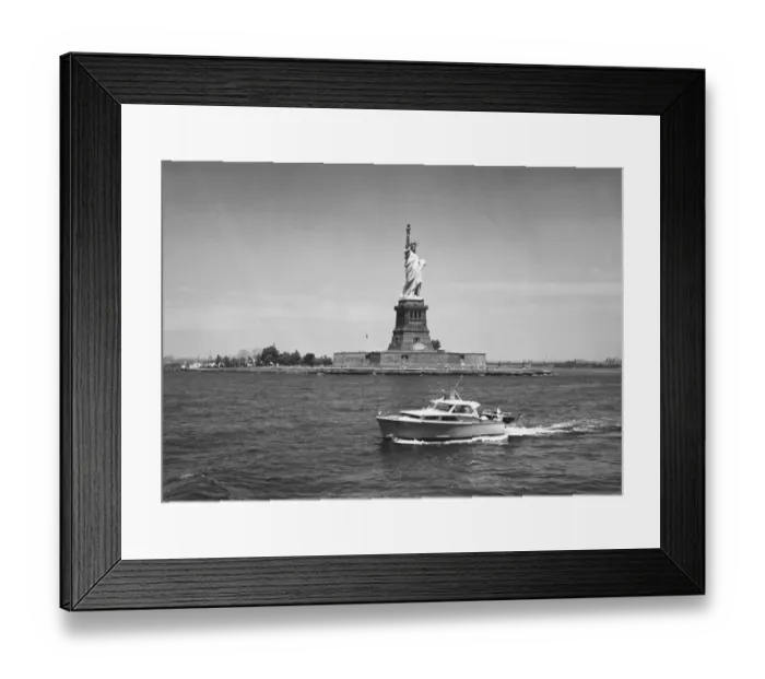 Framed Print : Boat floating by Statue of Liberty, New York City, USA, (B&W)