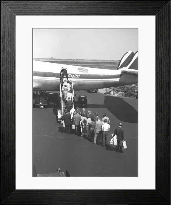 Framed Print : People boarding on airplane, (rear view), (B&W), elevated view Framed Print : People boarding on airplane, (rear view), (B&W), elevated view