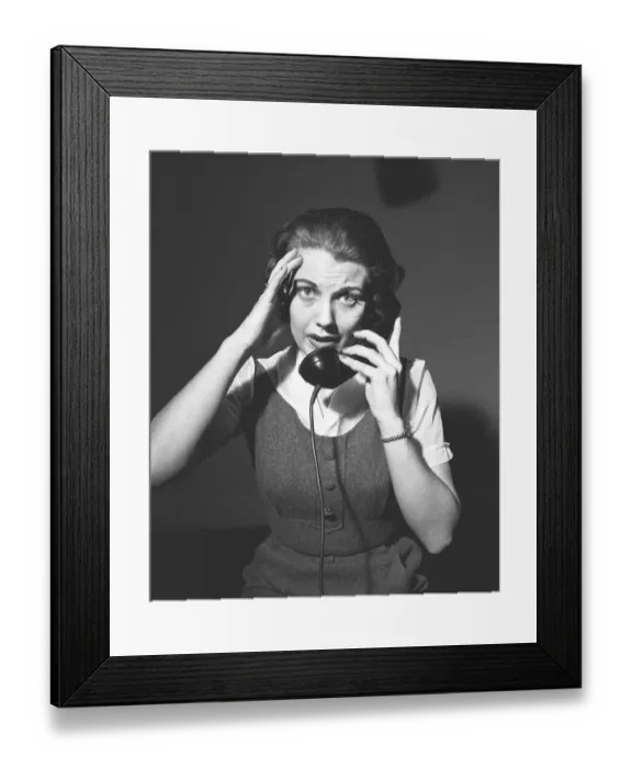 Framed Print : Worrying woman talking on phone, (B&W), portrait Framed Print : Worrying woman talking on phone, (B&W), portrait