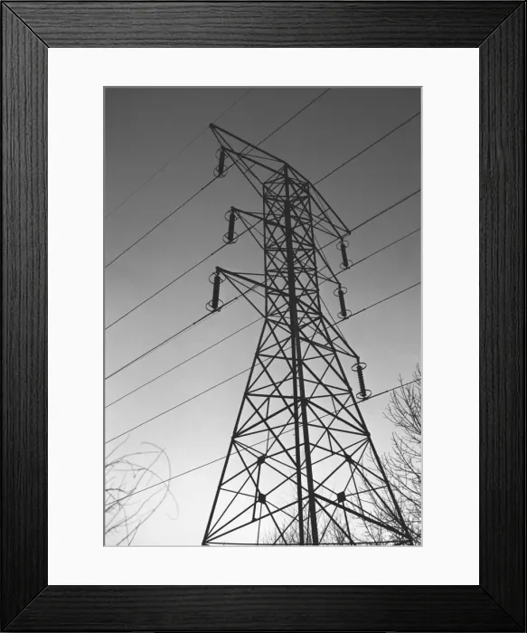 Framed Print : Electricity pylon, (B&W), low angle view Framed Print : Electricity pylon, (B&W), low angle view