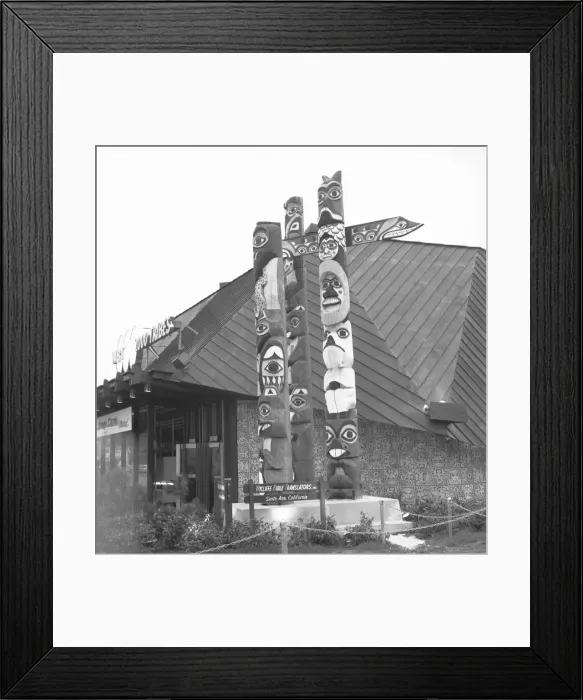 Framed Print : Totem poles at building, (B&W) Framed Print : Totem poles at building, (B&W)