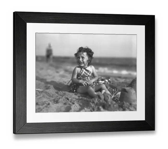 Framed Print : Girl (4-5) playing on beach, (B&W) Framed Print : Girl (4-5) playing on beach, (B&W)