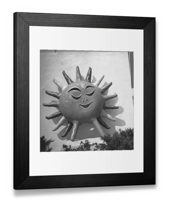 Framed Print : Sun with human face on building wall, (B&W) Framed Print : Sun with human face on building wall, (B&W)