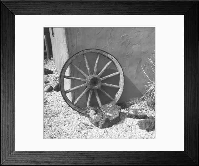 Framed Print : Cartwheel leaning by wall, (B&W) Framed Print : Cartwheel leaning by wall, (B&W)