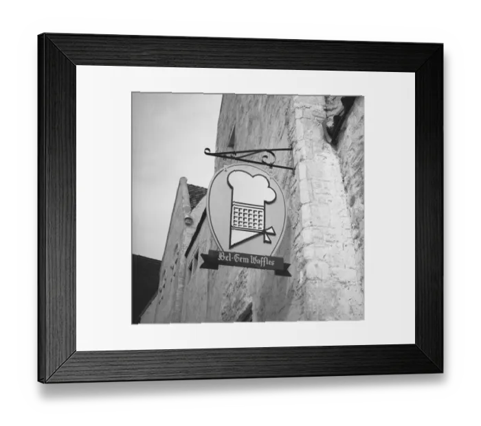 Framed Print : Bakery sign hanging on wall, (B&W), low angle view Framed Print : Bakery sign hanging on wall, (B&W), low angle view