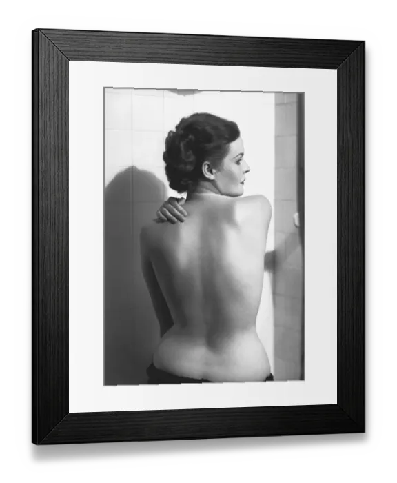 Framed Print : Semi dressed woman standing in bathroom, (rear view), (B&W) Framed Print : Semi dressed woman standing in bathroom, (rear view), (B&W)