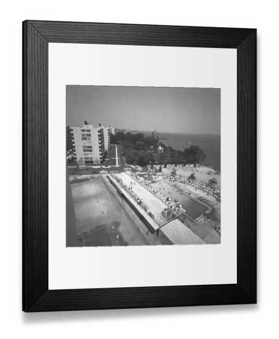 Framed Print : Outdoors swimming pool at seashore, (B&W), elevated view Framed Print : Outdoors swimming pool at seashore, (B&W), elevated view