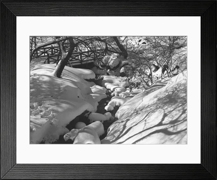 Framed Print : Stream and wooden bridge covered with snow Framed Print : Stream and wooden bridge covered with snow