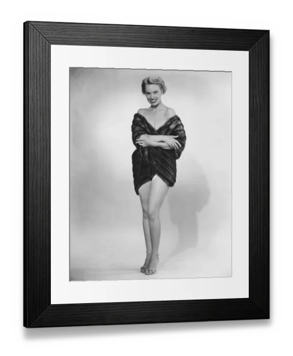 Framed Print : Woman wearing fur jacket posing in studio (B&W) Framed Print : Woman wearing fur jacket posing in studio (B&W)