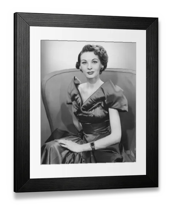 Framed Print : Woman in evening dress posing in studio (B&W), portrait Framed Print : Woman in evening dress posing in studio (B&W), portrait