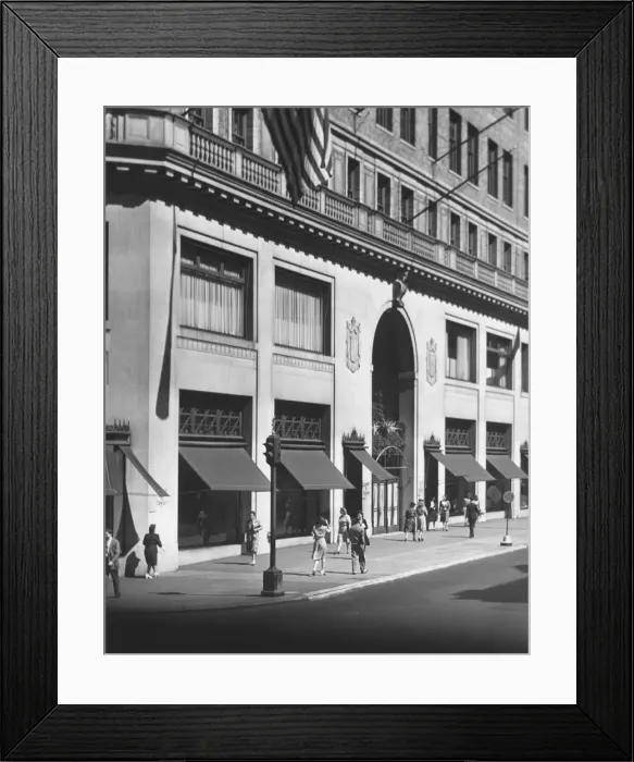 Framed Print : People walking on sidewalk along building (B&W) Framed Print : People walking on sidewalk along building (B&W)